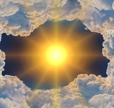 A very bright Sun parting clouds, suggesting a heatwave