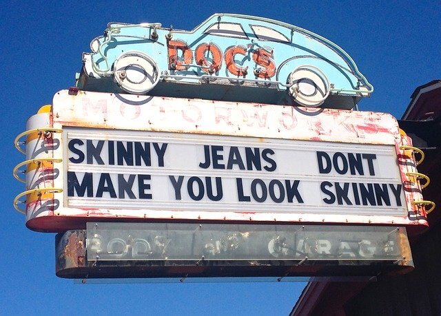 A sign that reads, "Skinny jeans don't make you look skinny."