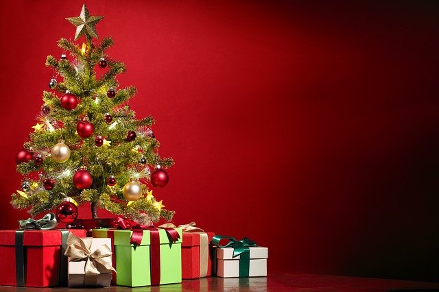 A Christmas tree surrounded by presents