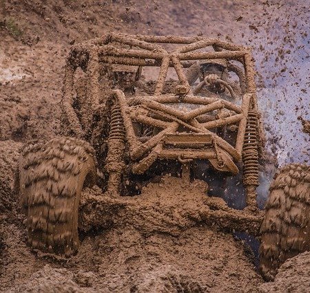 A 4x4 blasting through a lot of mud