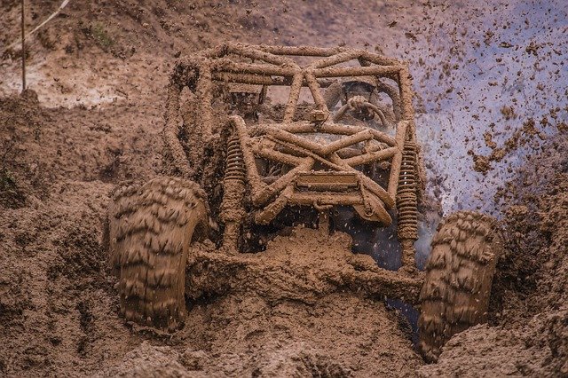 A 4x4 blasting through a lot of mud