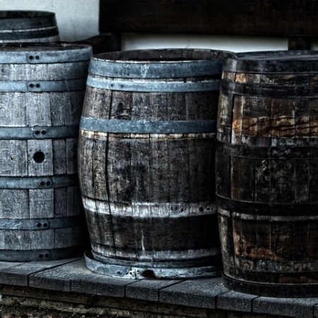 Three old wooden barrels