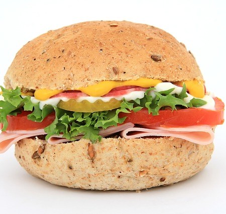 A ham sandwich with a selection of fillings