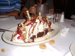 One very massive banana split = one very happy baboon.