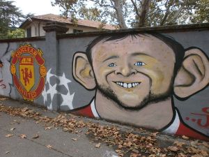 Wayne Rooney on a wall.