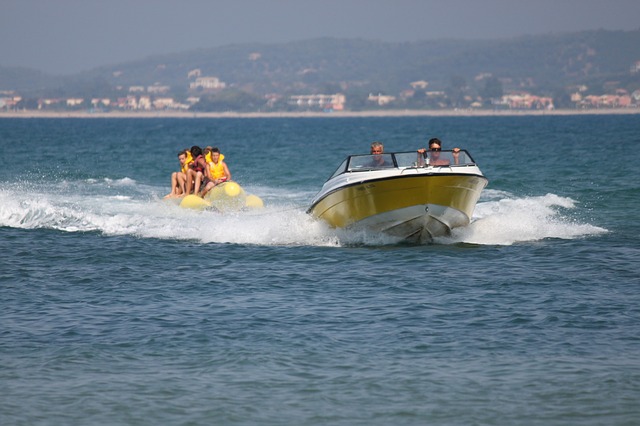 Speed boat and a banana boat on the ocean