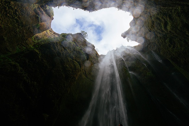 An extravagant crevice with a waterfall