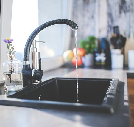 A leaking tap in a sink