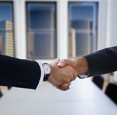 Shaking hands in an office