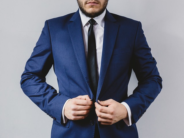 A man in a suit displaying chivalry