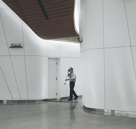 A janitor mopping the floor