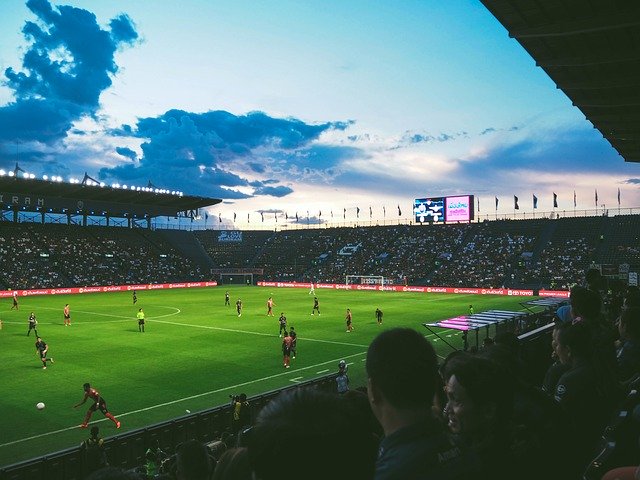 A football crowd at a match one beautiful evening