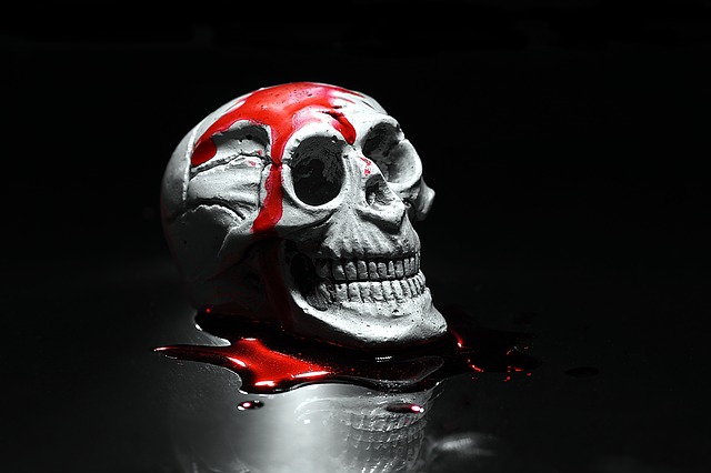 A human skull covered in horrifying blood
