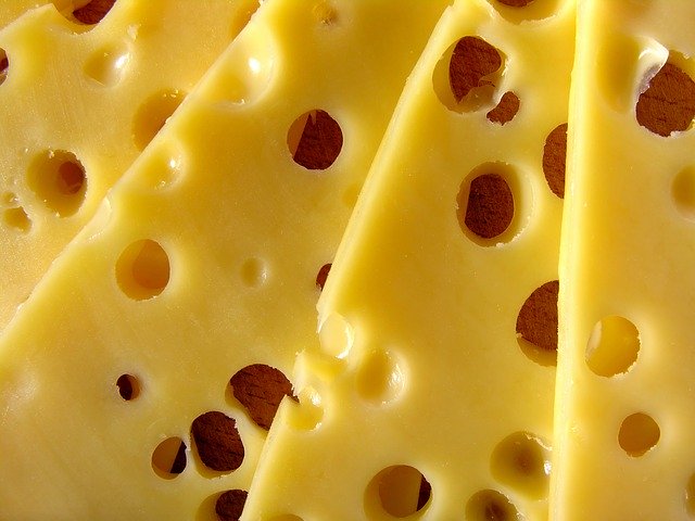A range of sliced cheeses