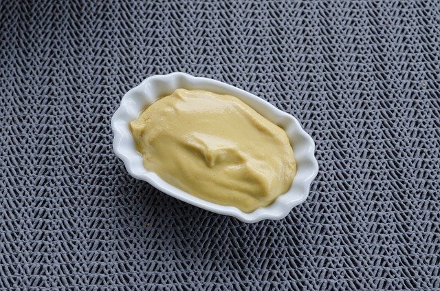 Mustard in a small cup
