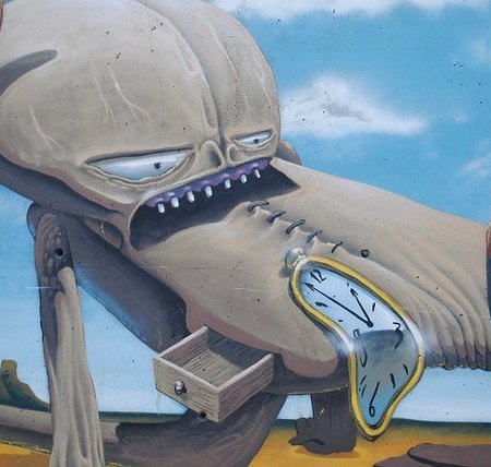 Salvador Dali painting of melting clocks and a monster