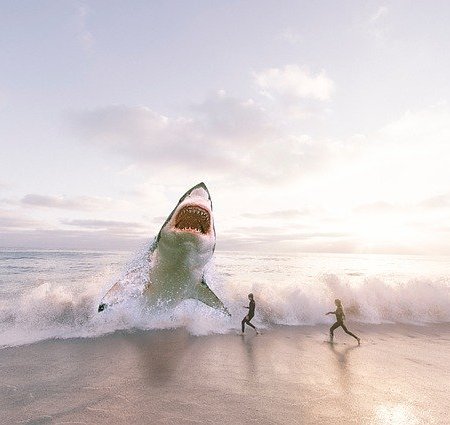 A shark leaping out of the water on a beach near two human runners