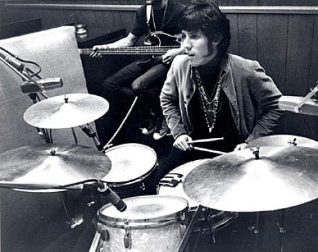 Drummer John Densmore sitting behind his kit