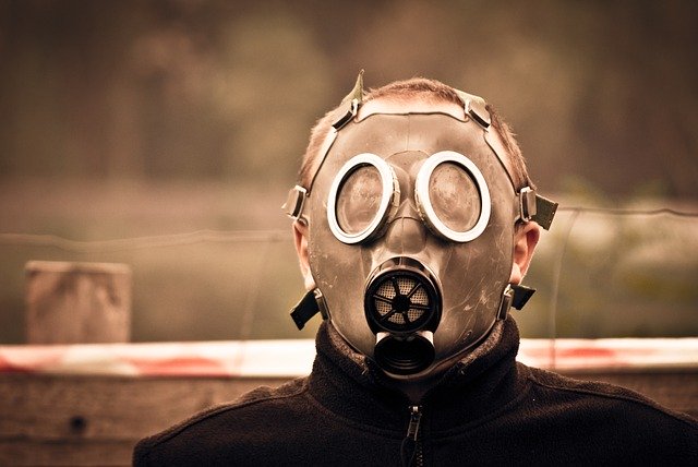 A man standing in a gas mask