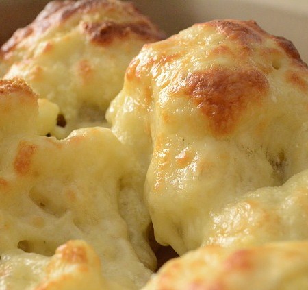 A picture of golden, crispy cauliflower cheese