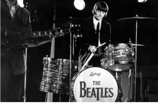 Ringo Starr playing the drums with The Beatles