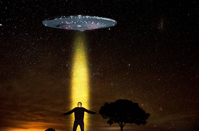 An alien spaceship abduction of a man at night