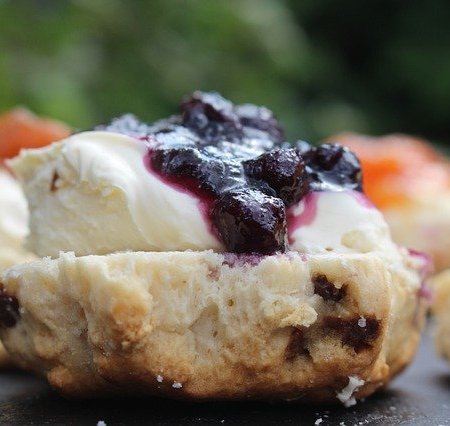 Scones with crème fraîche and jam on top