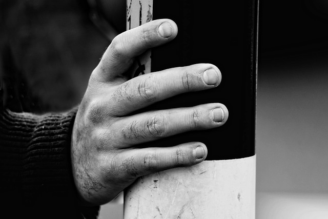 A hand in black and white showing the knuckles