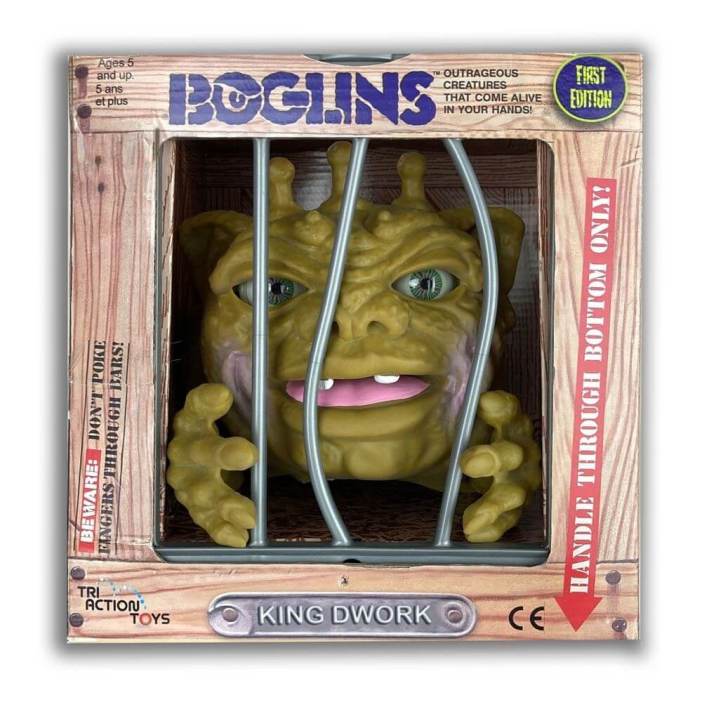 A Boglin toy in its cage box