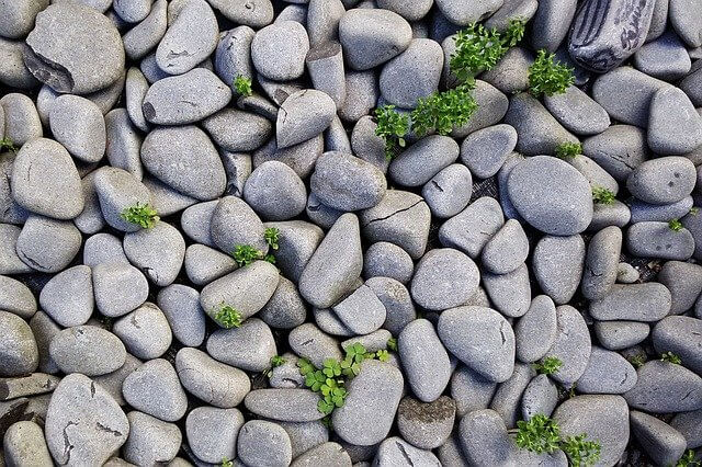 A large amount of grey pebbles on the ground