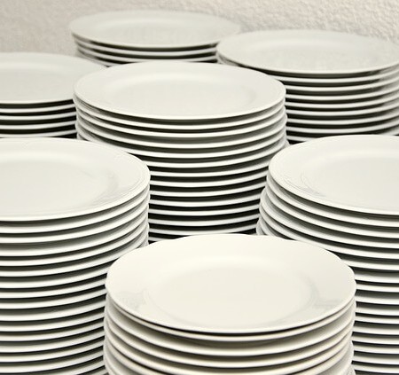 Clean dishes stacked up after being washed up