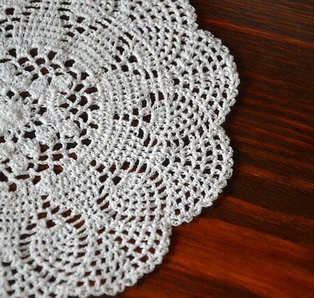 A white doily on a table