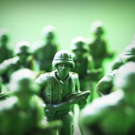 A toy soldier holding a bazooka