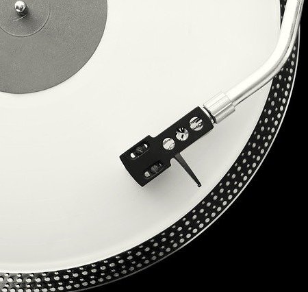 A black and white turntable sound player