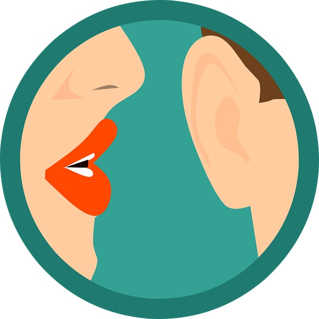 A woman with lipstick gossiping in a man's ear
