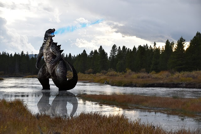 Godzilla rampaging through the countryside