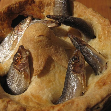 Stargazy pie with fish poking out of the pie crust