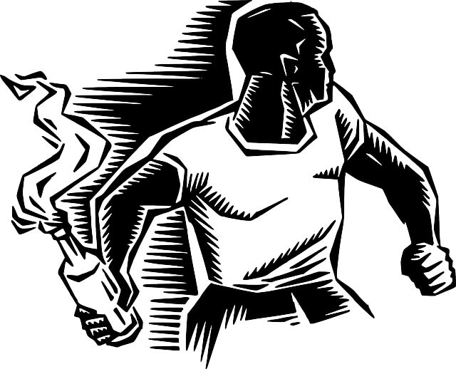 A man rioting with a bottle that's on fire