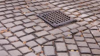 A streel grate in the pavement
