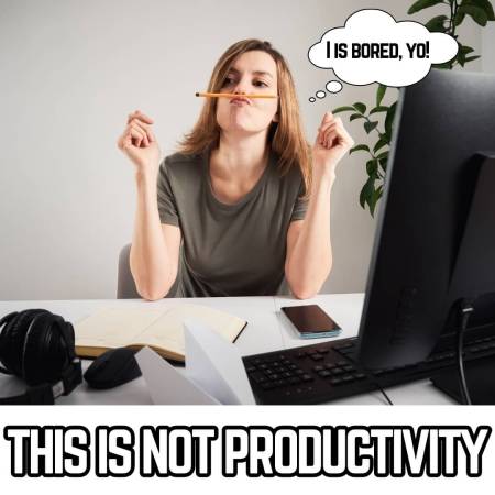 A bored employee at work balancing a pencil on her nose